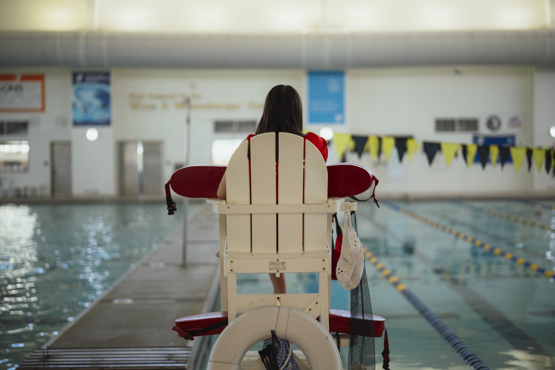 a person in a chair in a swimming pool