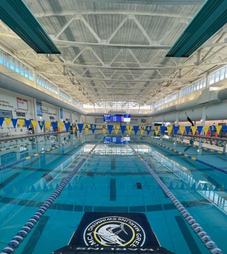 a large swimming pool with a sign on the side of it