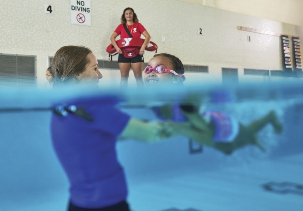 a group of people in a swimming pool