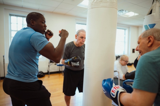 a group of people boxing