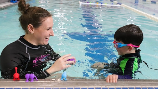 a woman and a child in a swimming pool